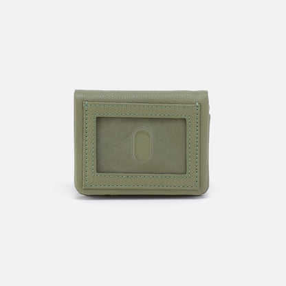 Green wallet with a card holder on a white background