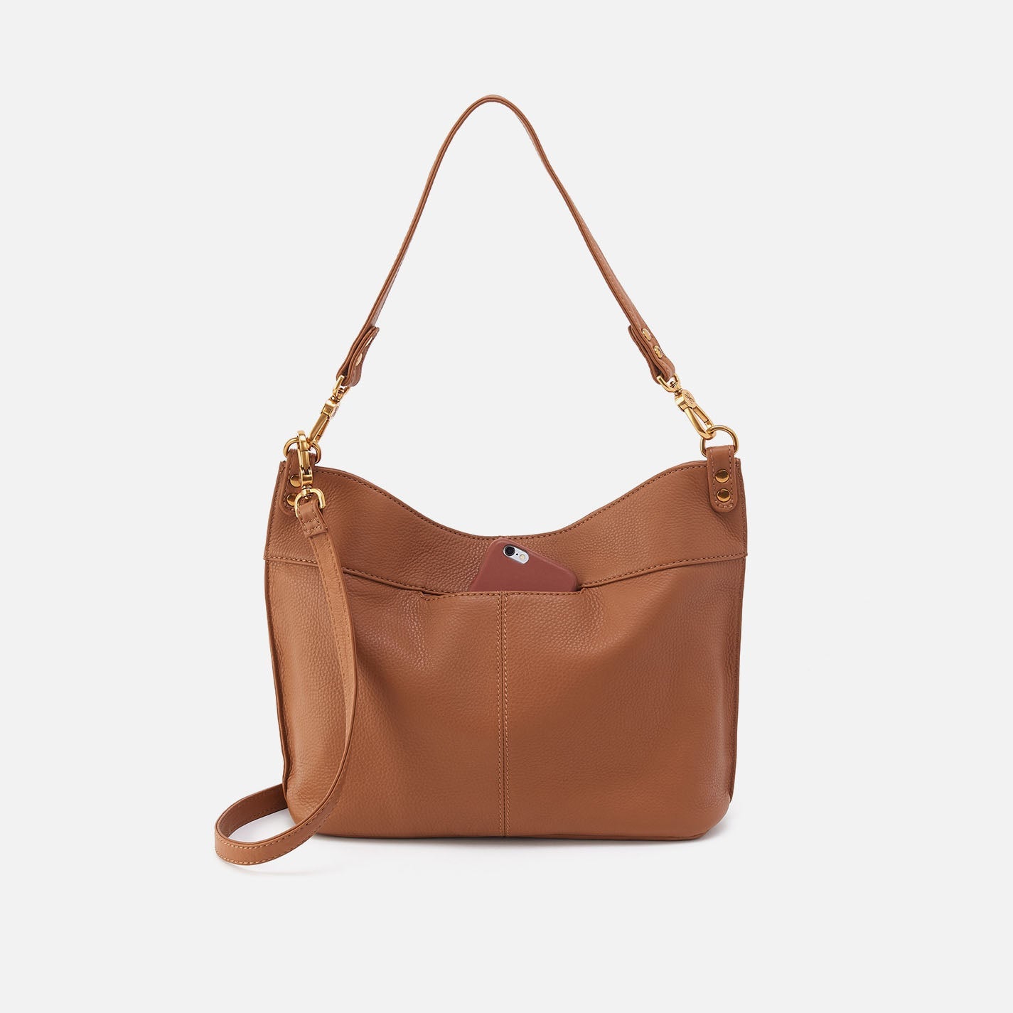 Brown leather handbag with gold accents on a light gray background