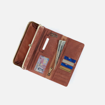 Brown leather wallet with various compartments on a white background