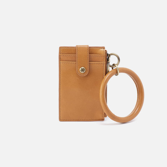 Tan leather keychain wallet with a ring on a white background