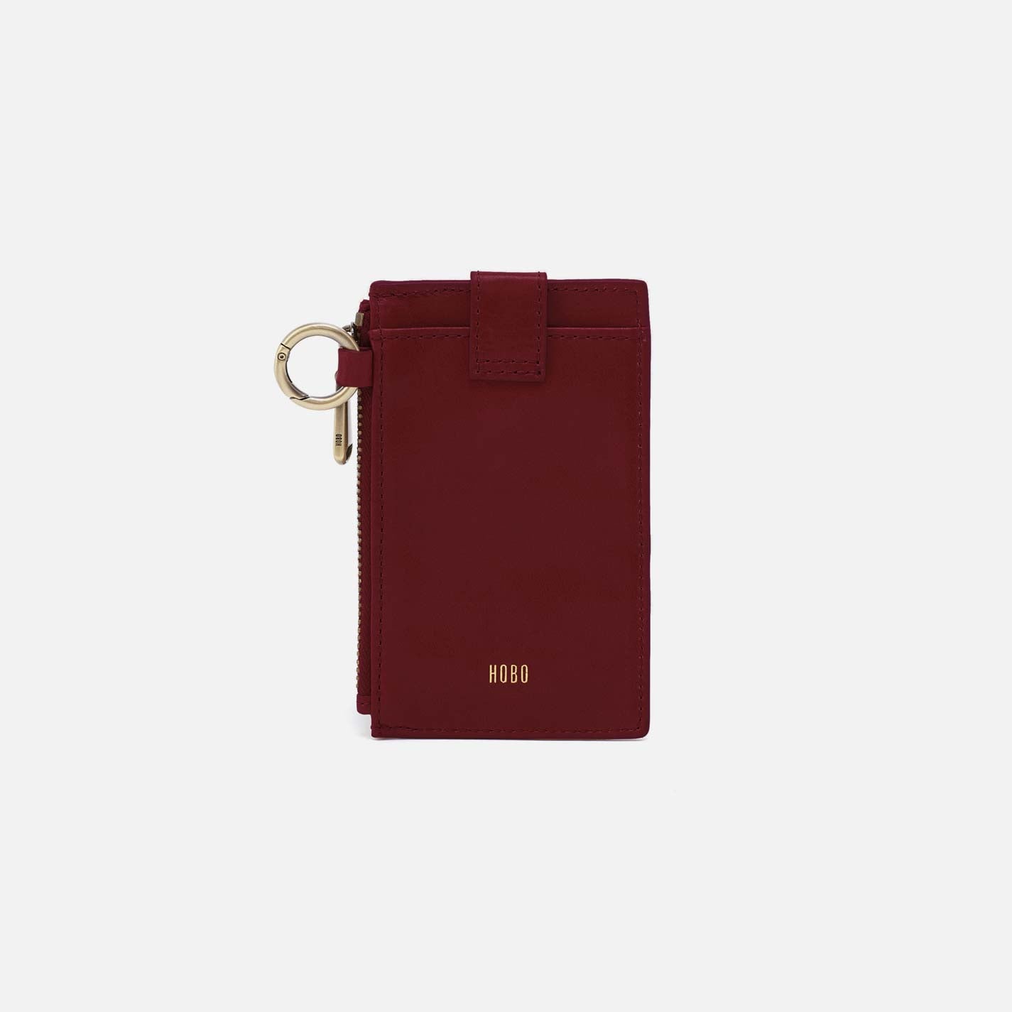 Maroon phone case with keychain on a white background