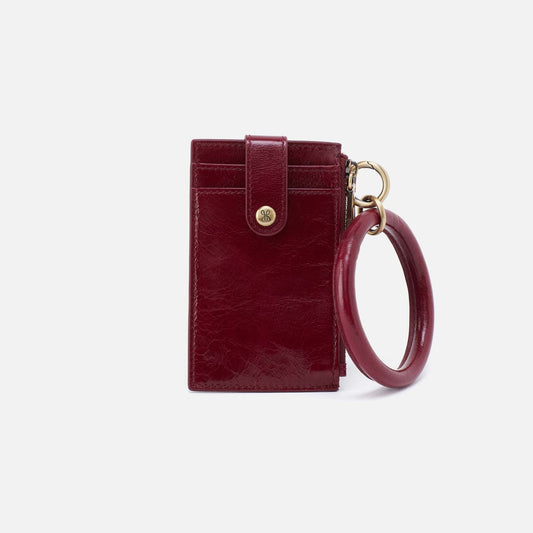 Burgundy leather wallet with keychain on a white background