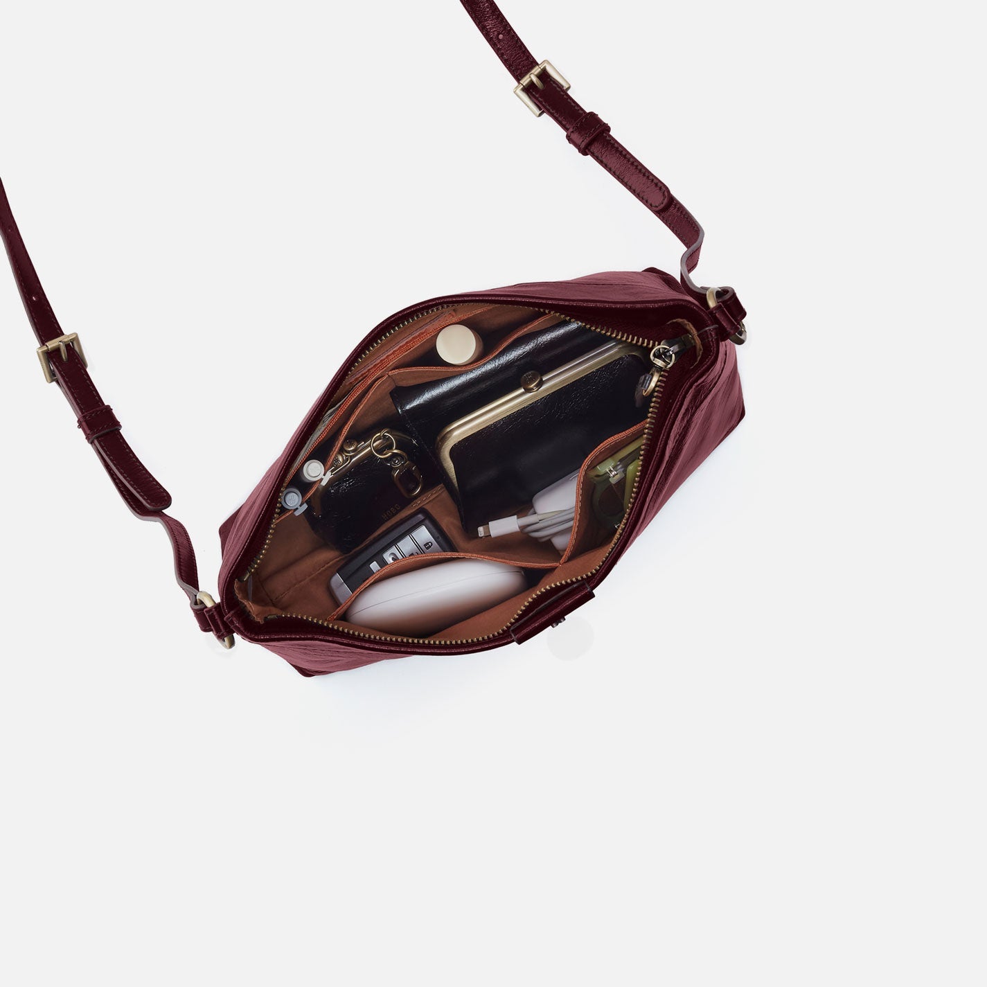 Maroon handbag with gold accents on a white background