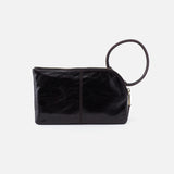 Black leather clutch bag with a ring handle on a white background