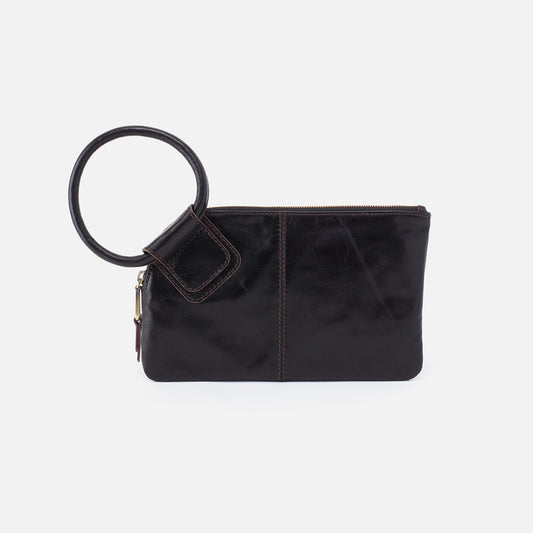 Black clutch bag with circular handle on a white background