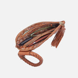 Brown leather clutch with tassel on a white background