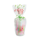 Packaged colorful straws with a decorative bow on a white background