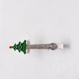Spoon with Christmas tree design and 'Holiday Delights' text on a white background