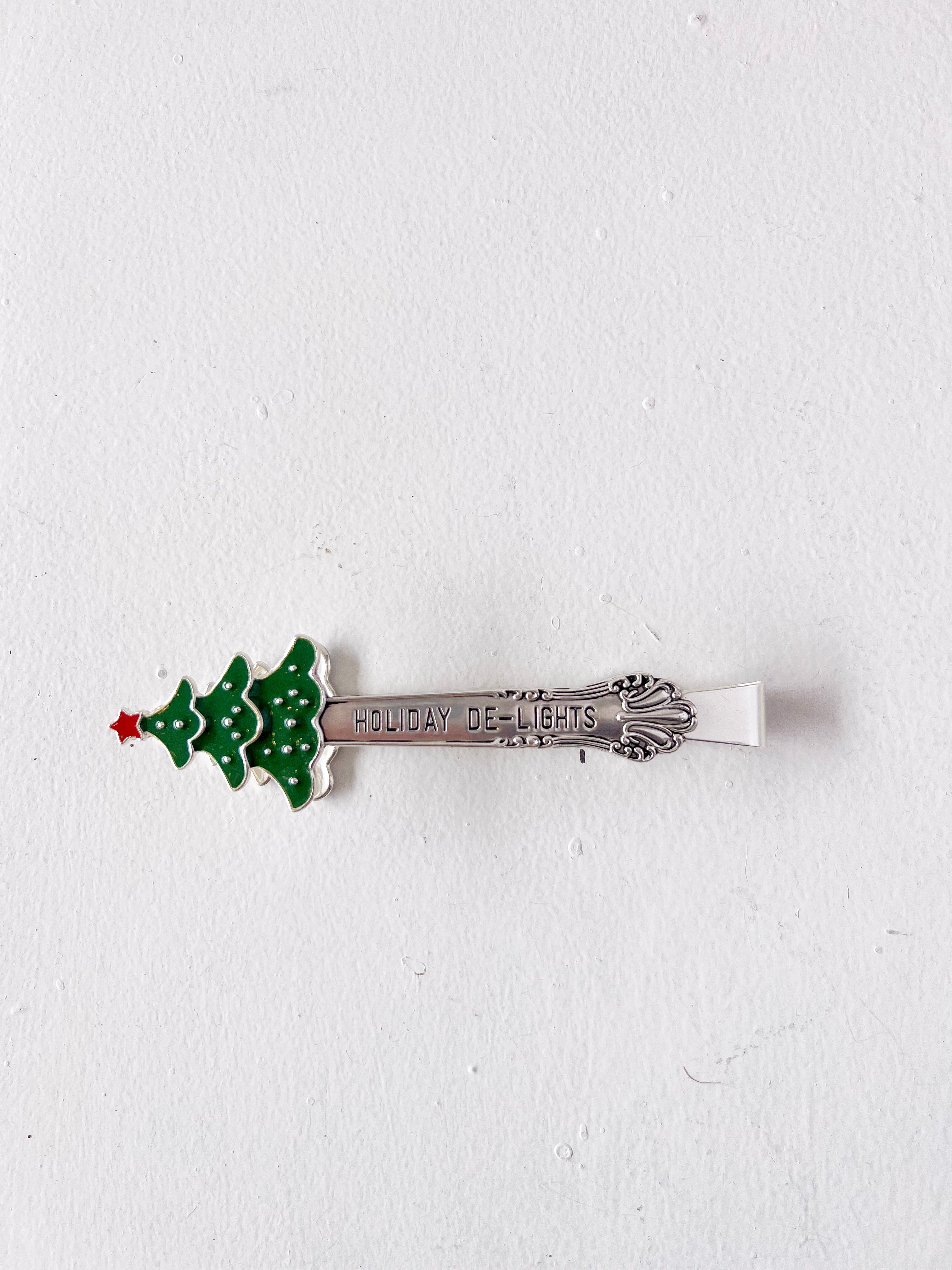 Spoon with Christmas tree design and 'Holiday Delights' text on a white background