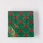 Green box with red bow pattern on a white background
