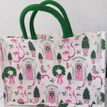 Tote bag with festive design featuring trees, wreaths, and pink bows on a white background