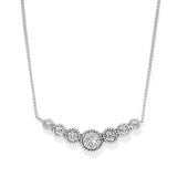 Silver necklace with circular pendants on a white background