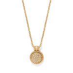 Gold necklace with a round, diamond-studded pendant on a white background