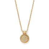 Gold necklace with a round, diamond-studded pendant on a white background