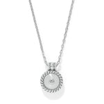 Silver necklace with a round pendant on a white background