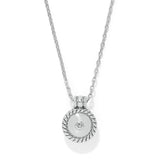Silver necklace with a round pendant on a white background