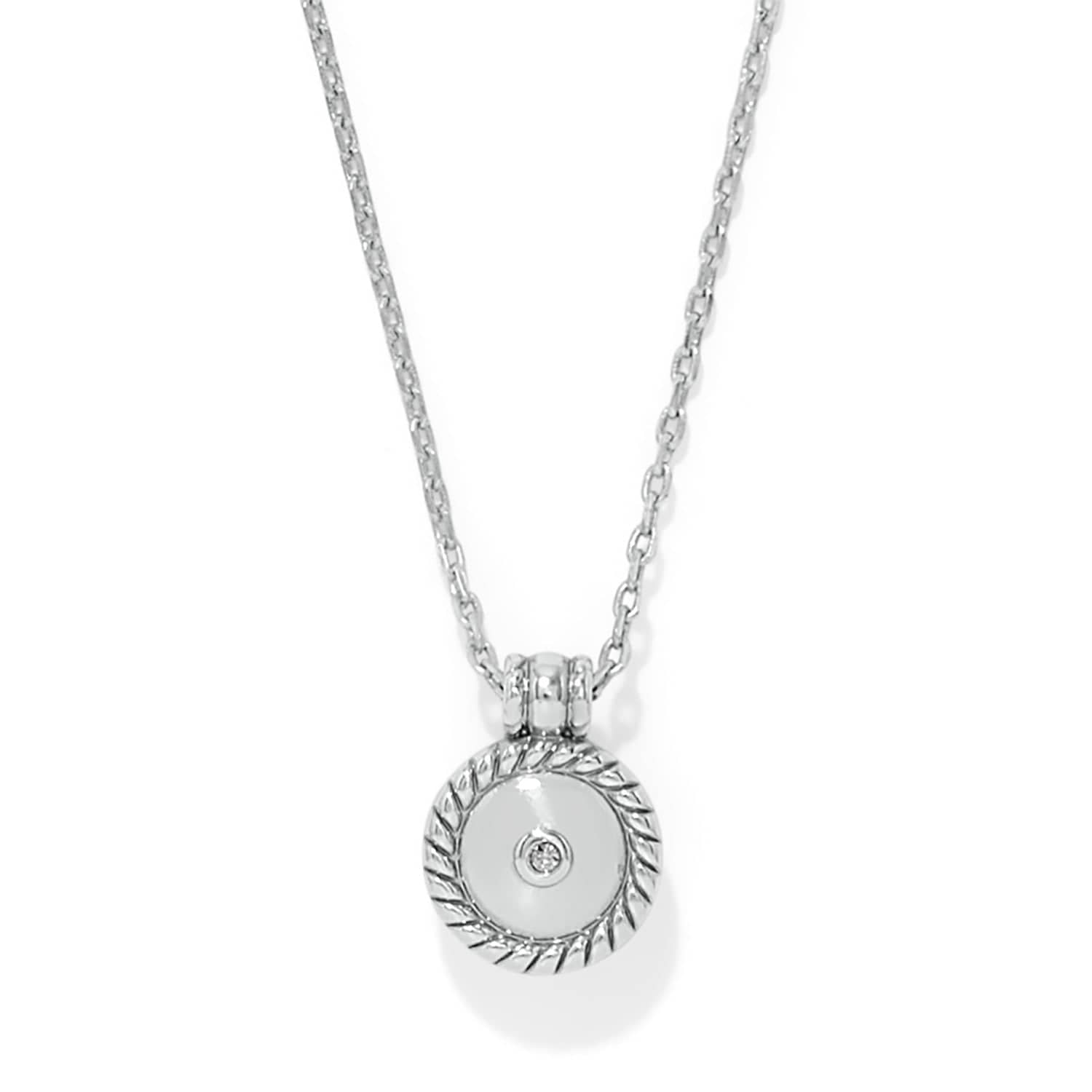 Silver necklace with a round pendant on a white background