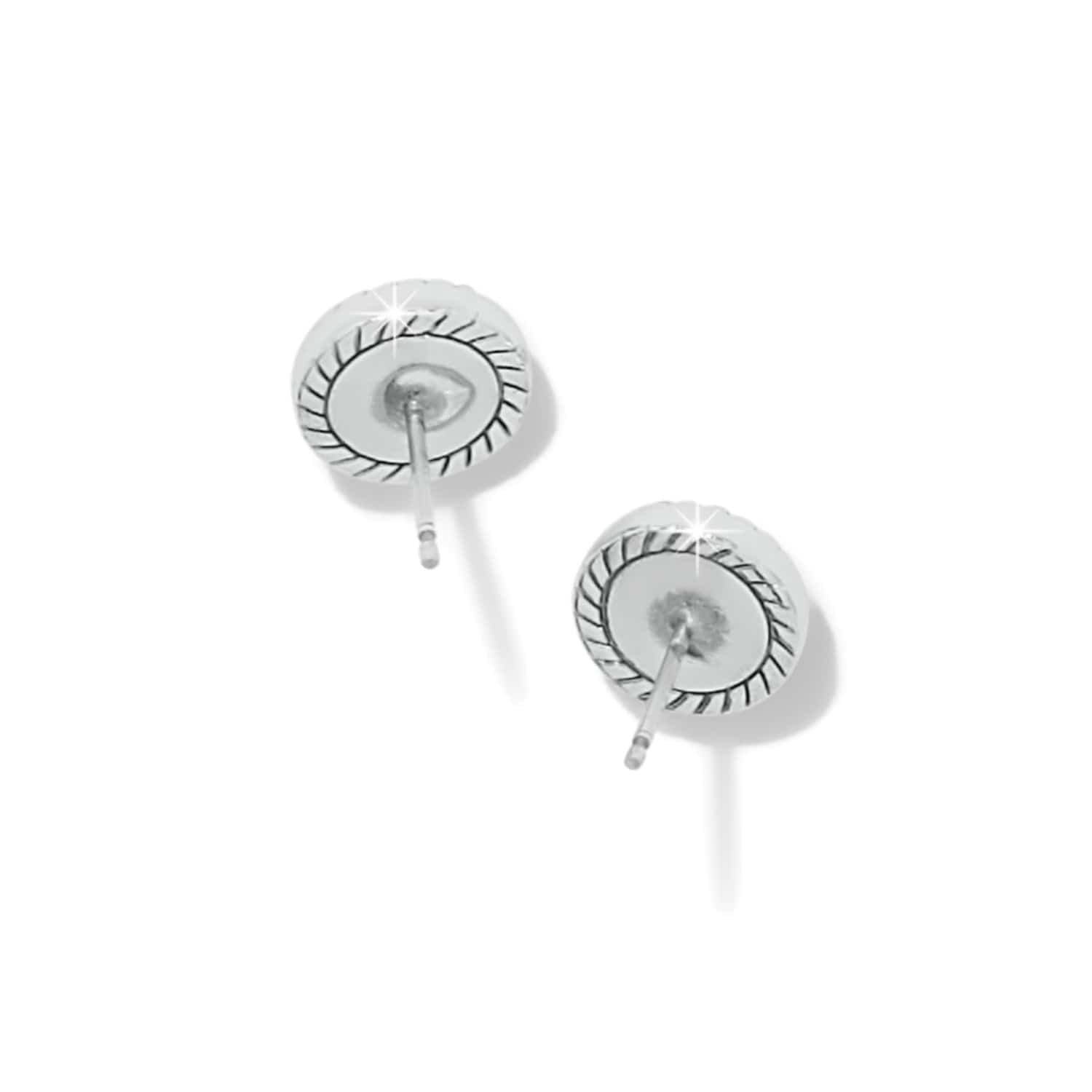 Pair of silver earrings with circular design on a white background