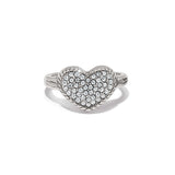 Heart-shaped silver ring with embedded stones on a white background