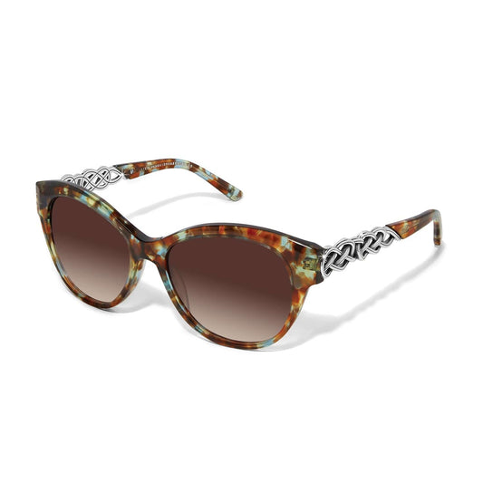 Sunglasses with tortoiseshell frame and gradient lenses on a white background