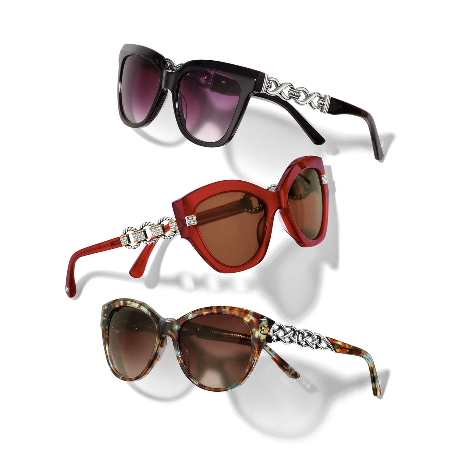 Three pairs of sunglasses with decorative arm bands on a white background