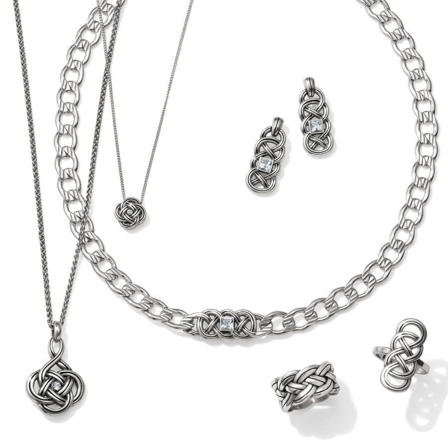 Silver jewelry set including necklaces and earrings on a white background