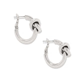 Silver hoop earrings with knot design on a white background