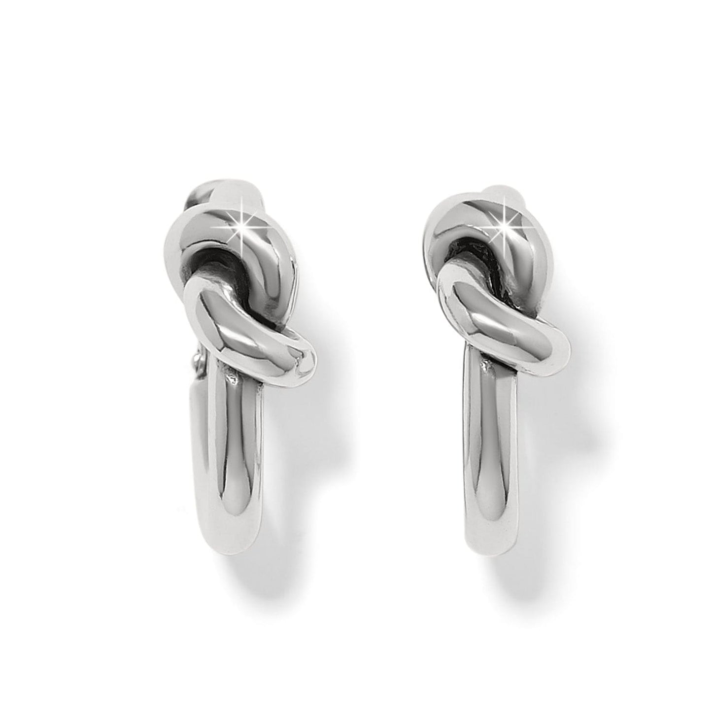Pair of silver knot earrings on a white background