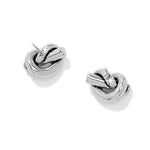 Pair of silver knot earrings on a white background