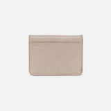 Back of the Jill Bi-Fold Wallet showing the exterior zip pocket in stone gloss leather.