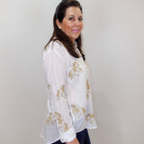 Model wearing the Johnny Was Cheval oversized shirt in white with gold horse print and button-front design.