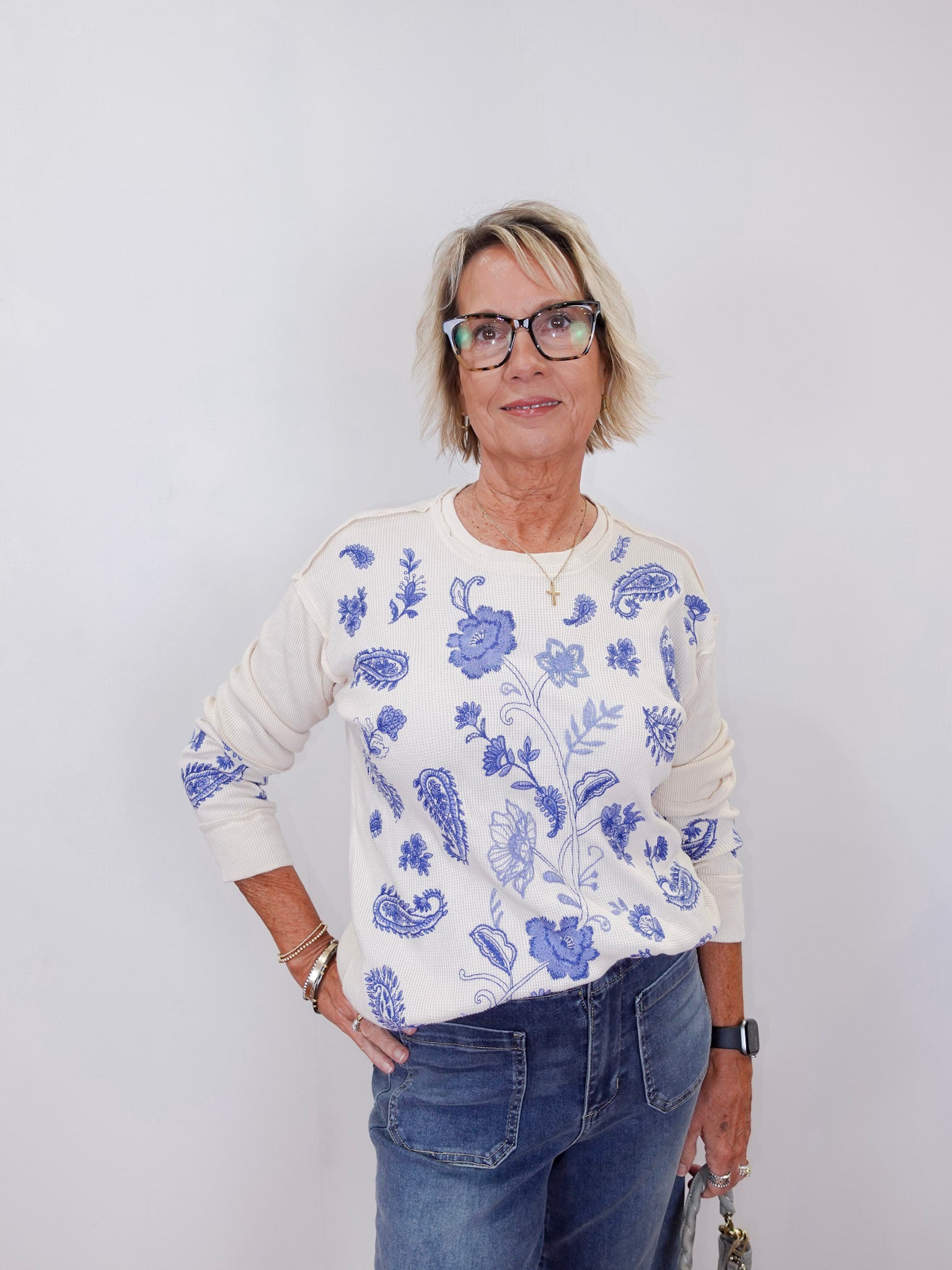 model wearing a cream johnny was daniela patchwork thermal long sleeve tee with blue floral and paisley print