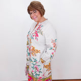 Woman wearing a floral dress with a white background