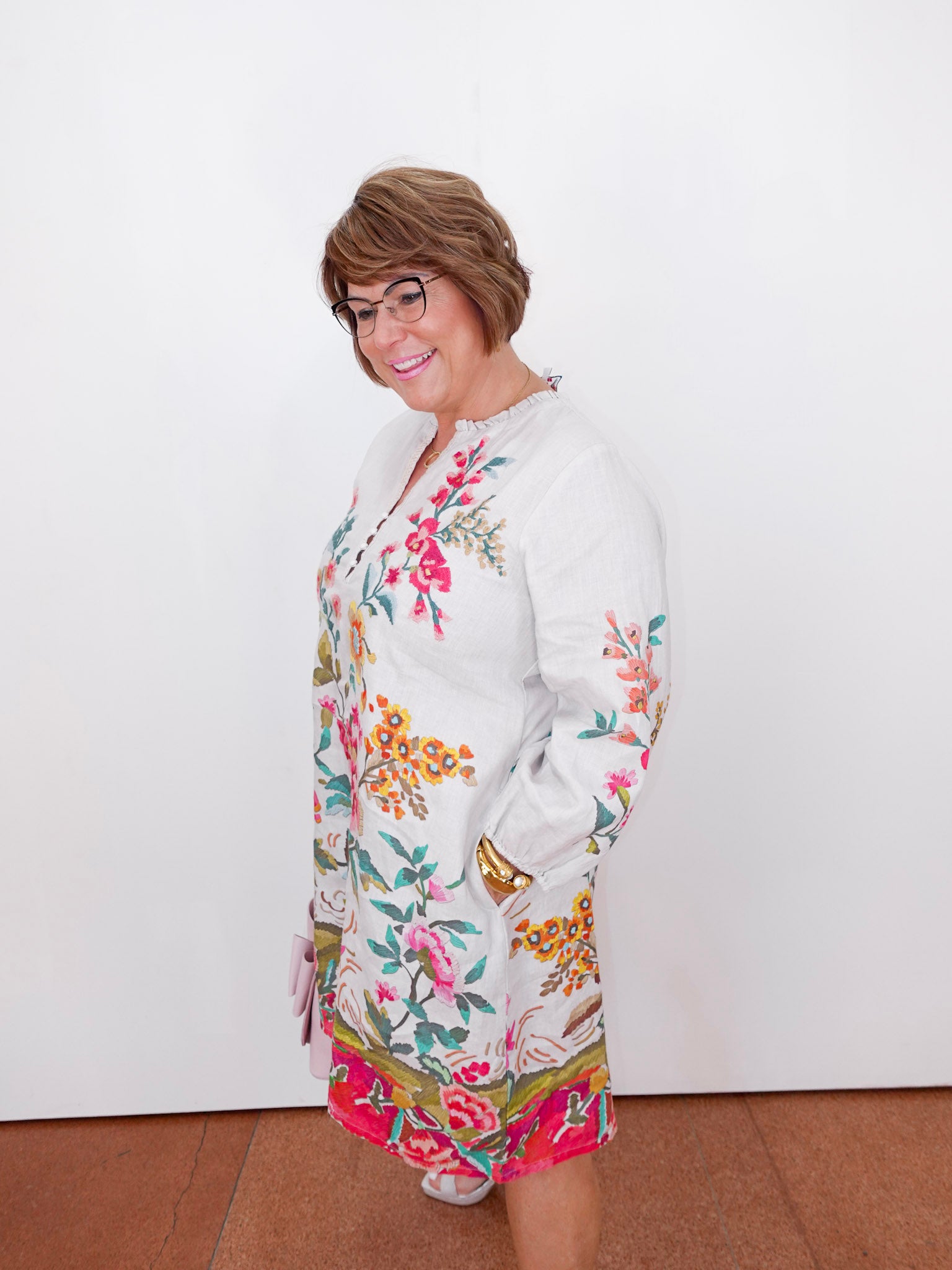 Woman wearing a floral dress with a white background