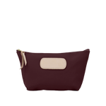 Maroon pouch with beige patch and zipper on a white background