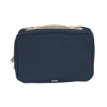 Navy toiletry bag with beige accents on a white background