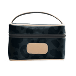 Camouflage-patterned cosmetic bag with a beige patch on a black background