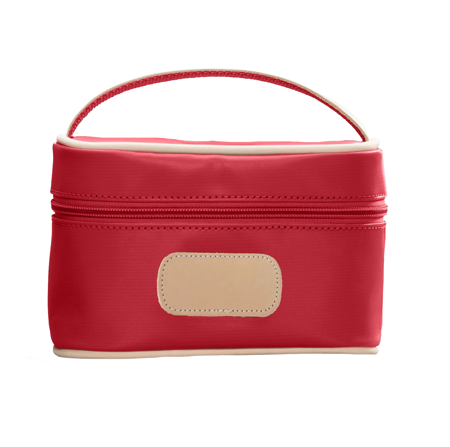 Red cosmetic bag with beige handle and patch on a black background