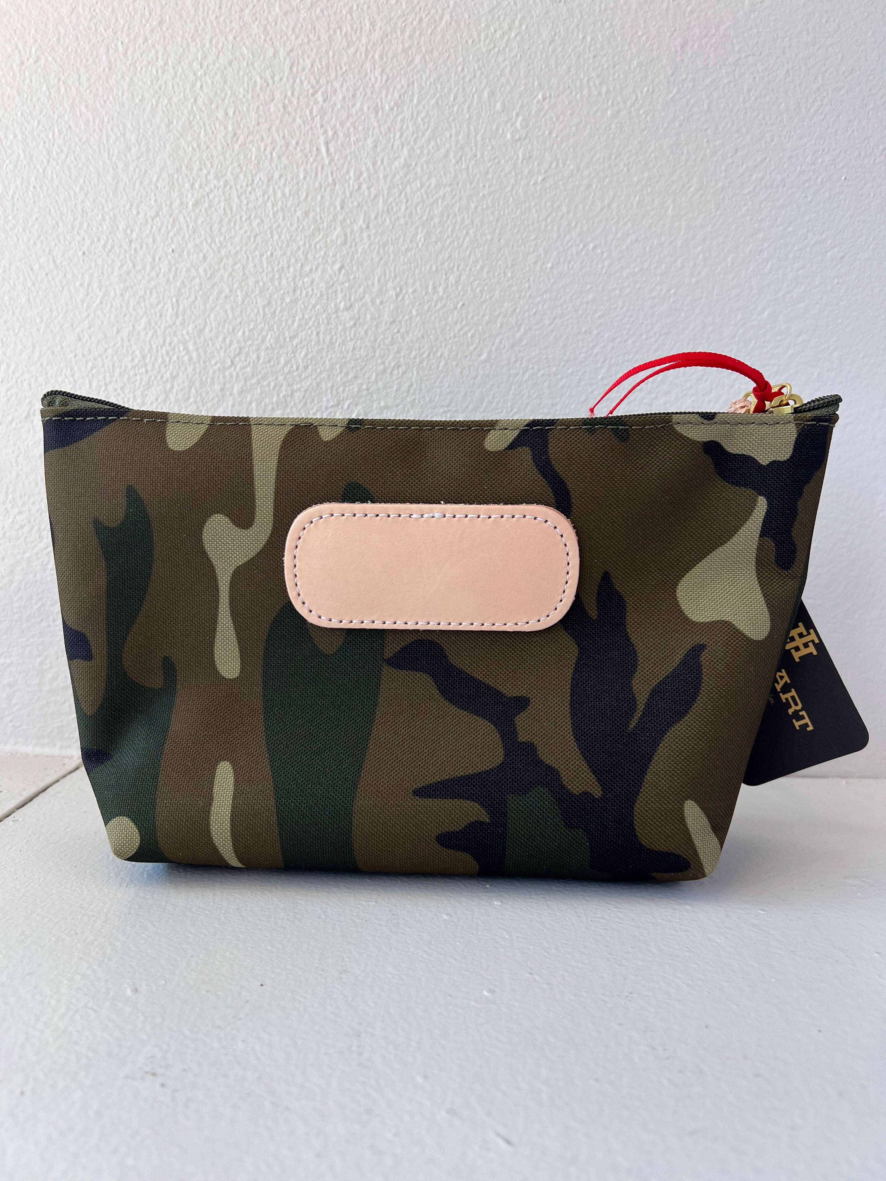 Camouflage pouch with beige flap on a white background