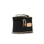 Black cosmetic bag with beige accents on a white background