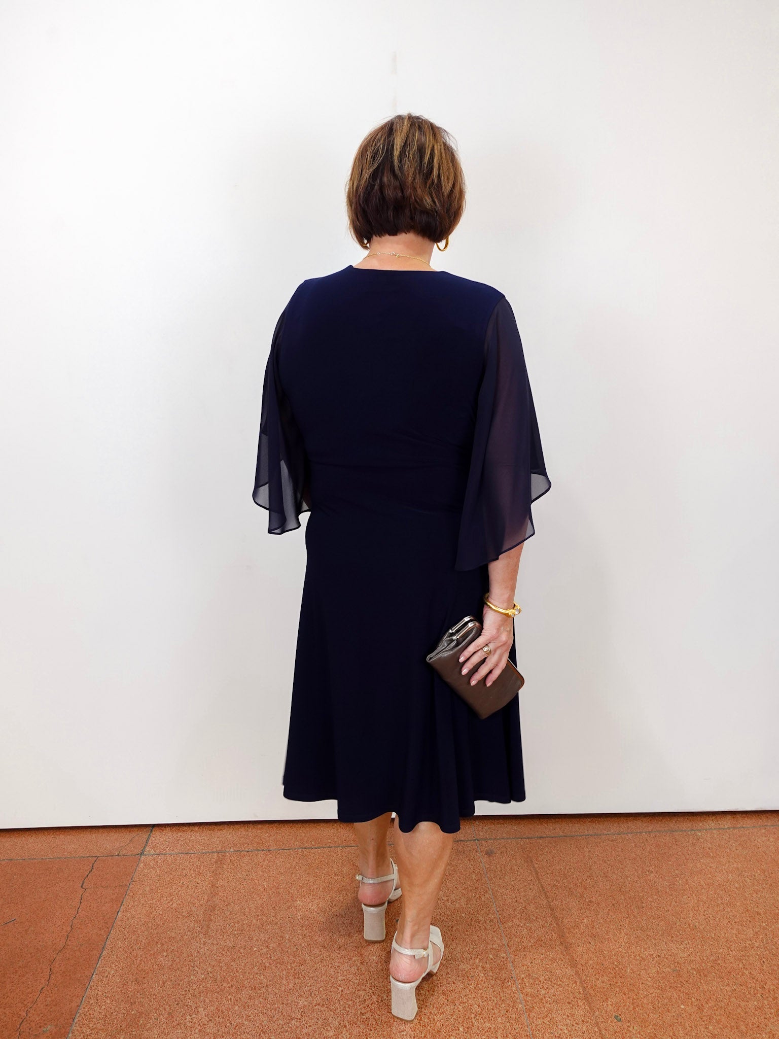 Joseph Ribkoff navy fit and flare dress with v-neckline.