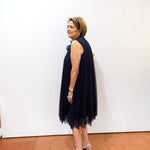 Joseph Ribkoff navy high neck A-line dress with pleated design.