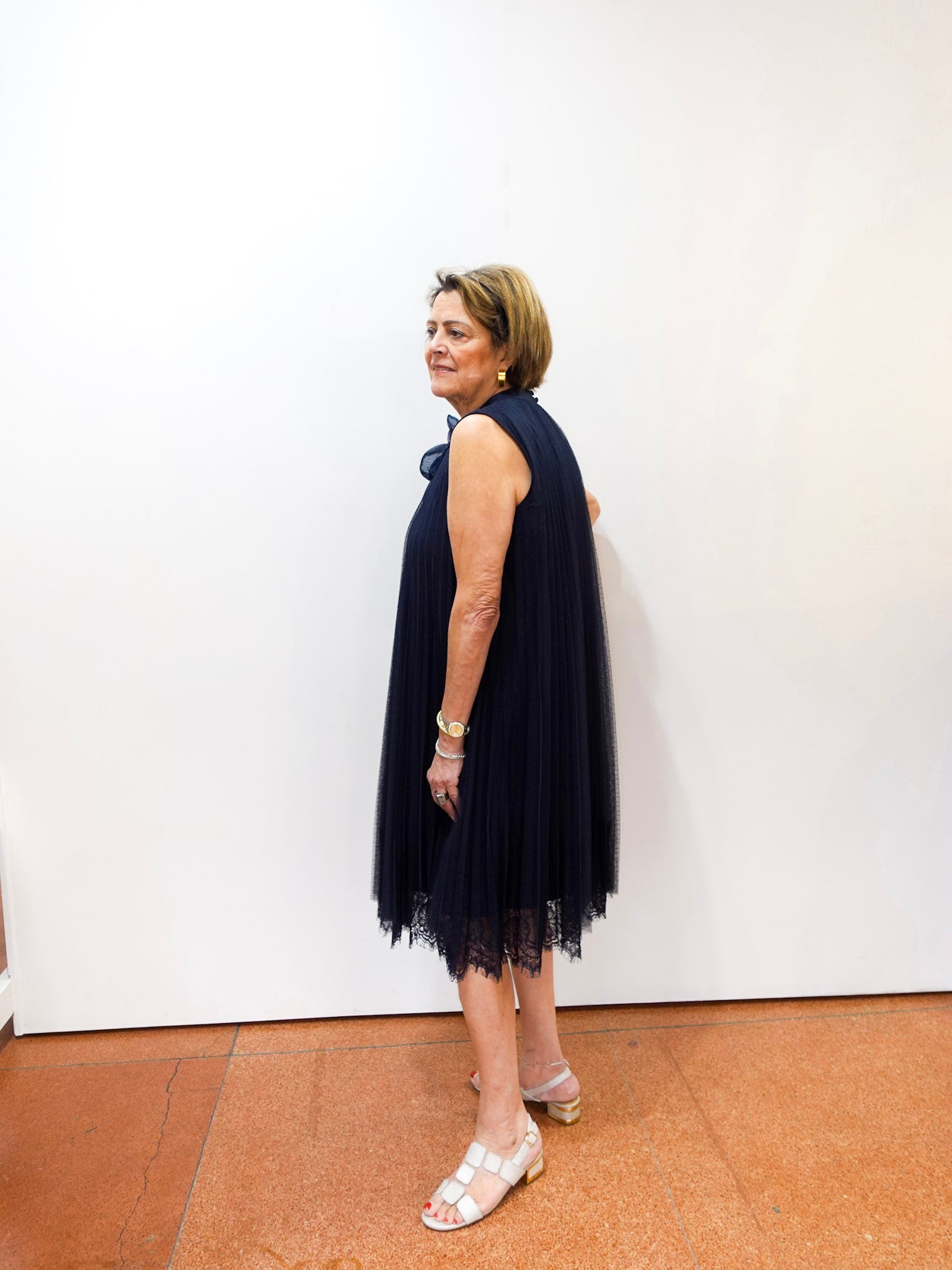 Joseph Ribkoff navy high neck A-line dress with pleated design.