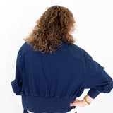 Person wearing a blue outfit on a white background