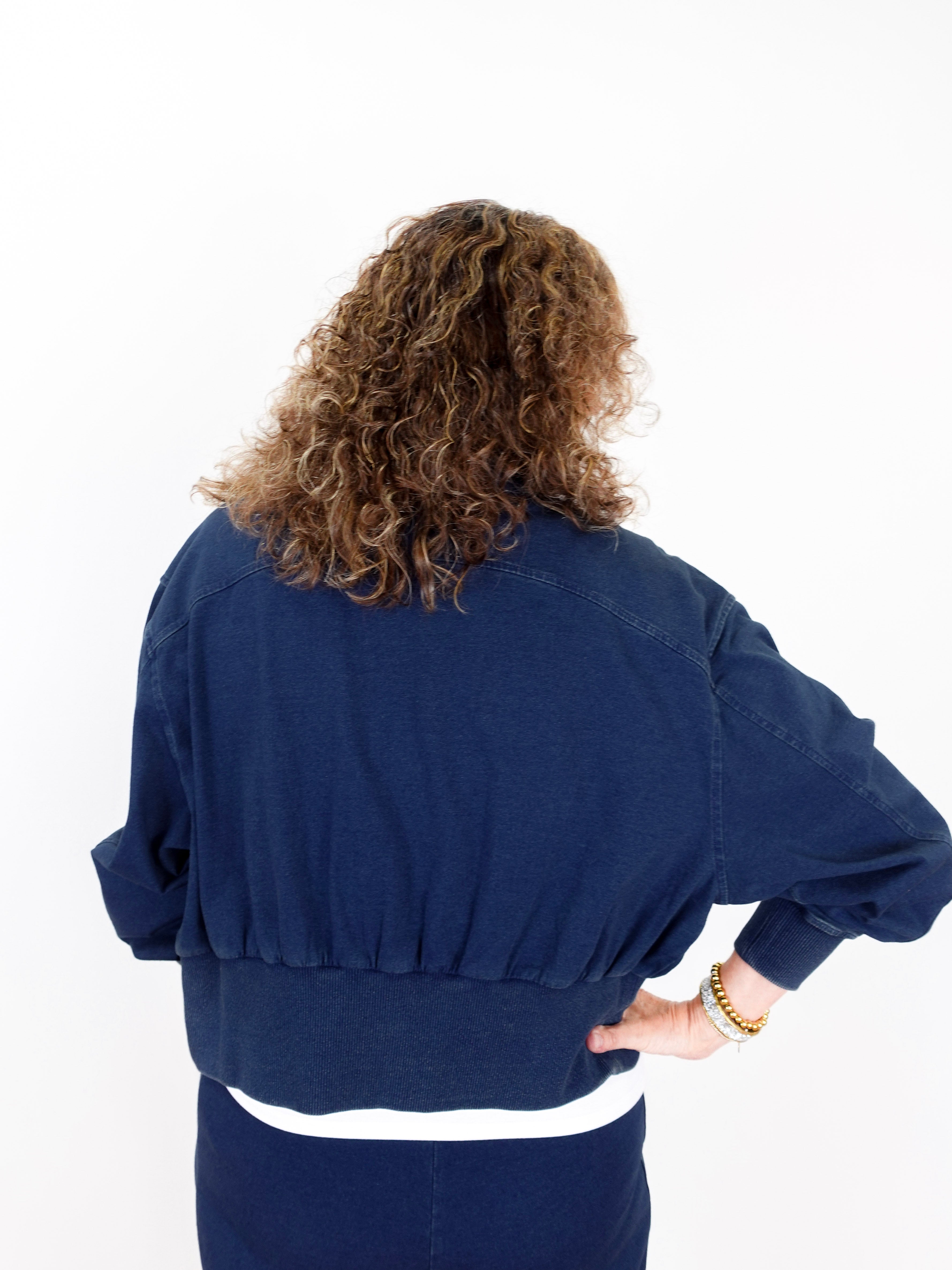 Person wearing a blue outfit on a white background