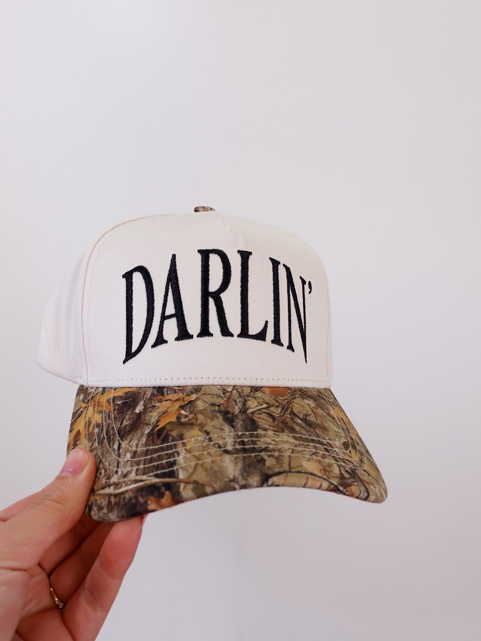 Cap with 'DARLIN'' text on a white background