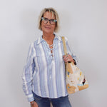 womens karen kane long sleeve lace up top styled casually with jeans and tote bag