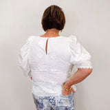 front view of the white puff sleeve embroidered top by karen kane