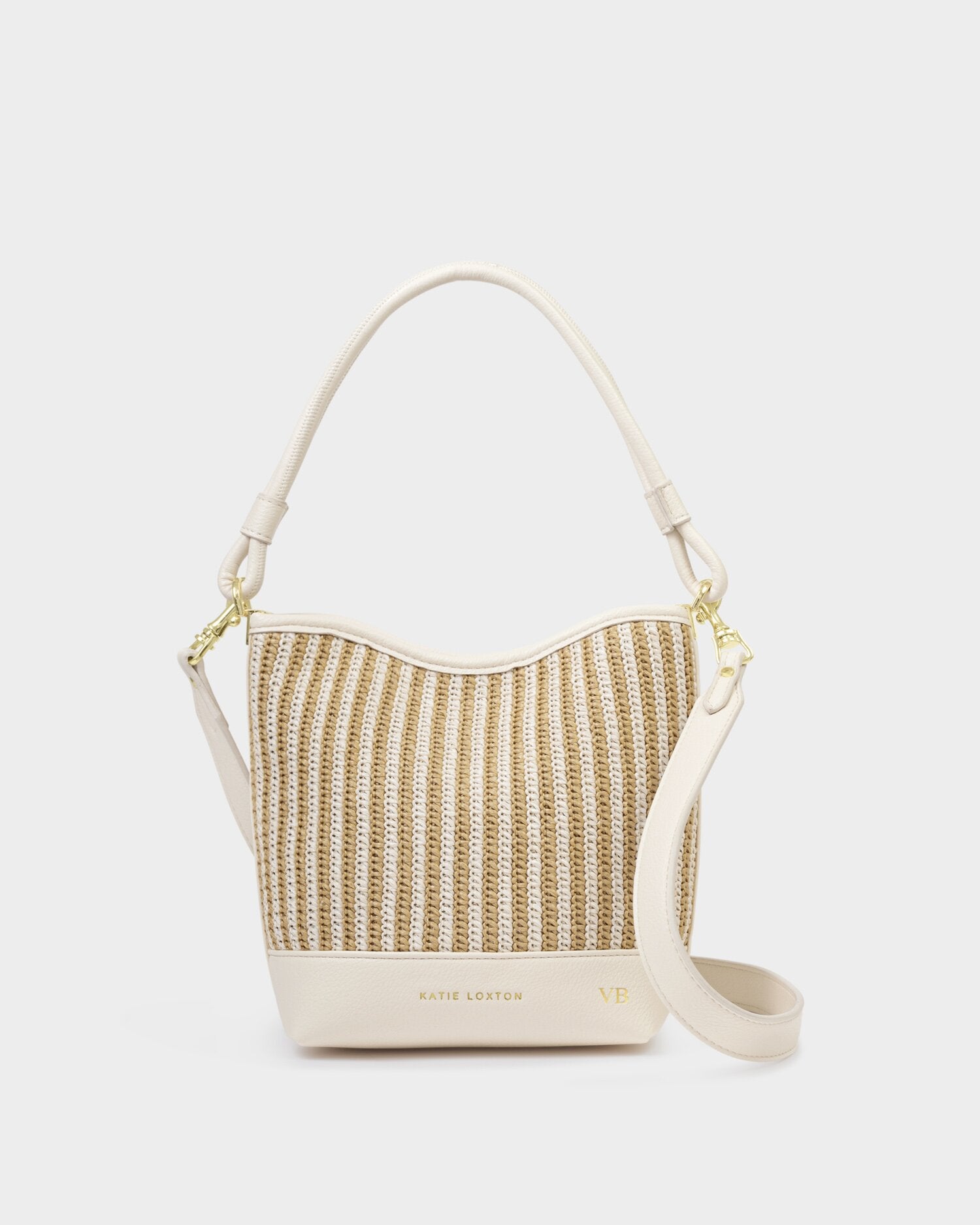 Woven handbag with beige strap on a white background