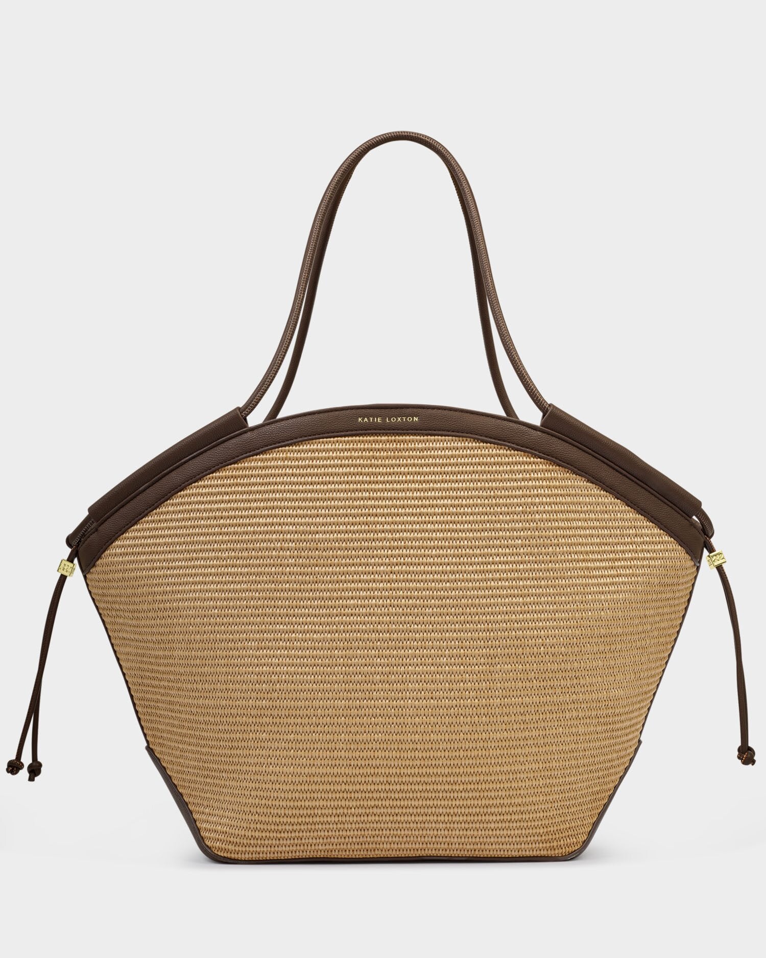 Beige handbag with brown leather accents on a light gray background